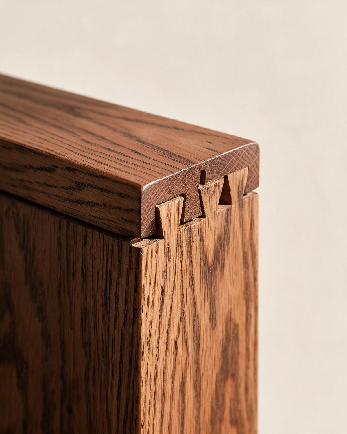 Dovetailed solid timber drawer corner, showing continuous grain over the edge