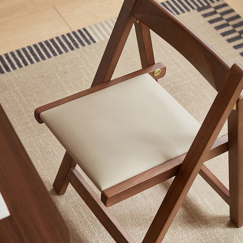 Kurt folding timber dining chair in walnut colour – view 3